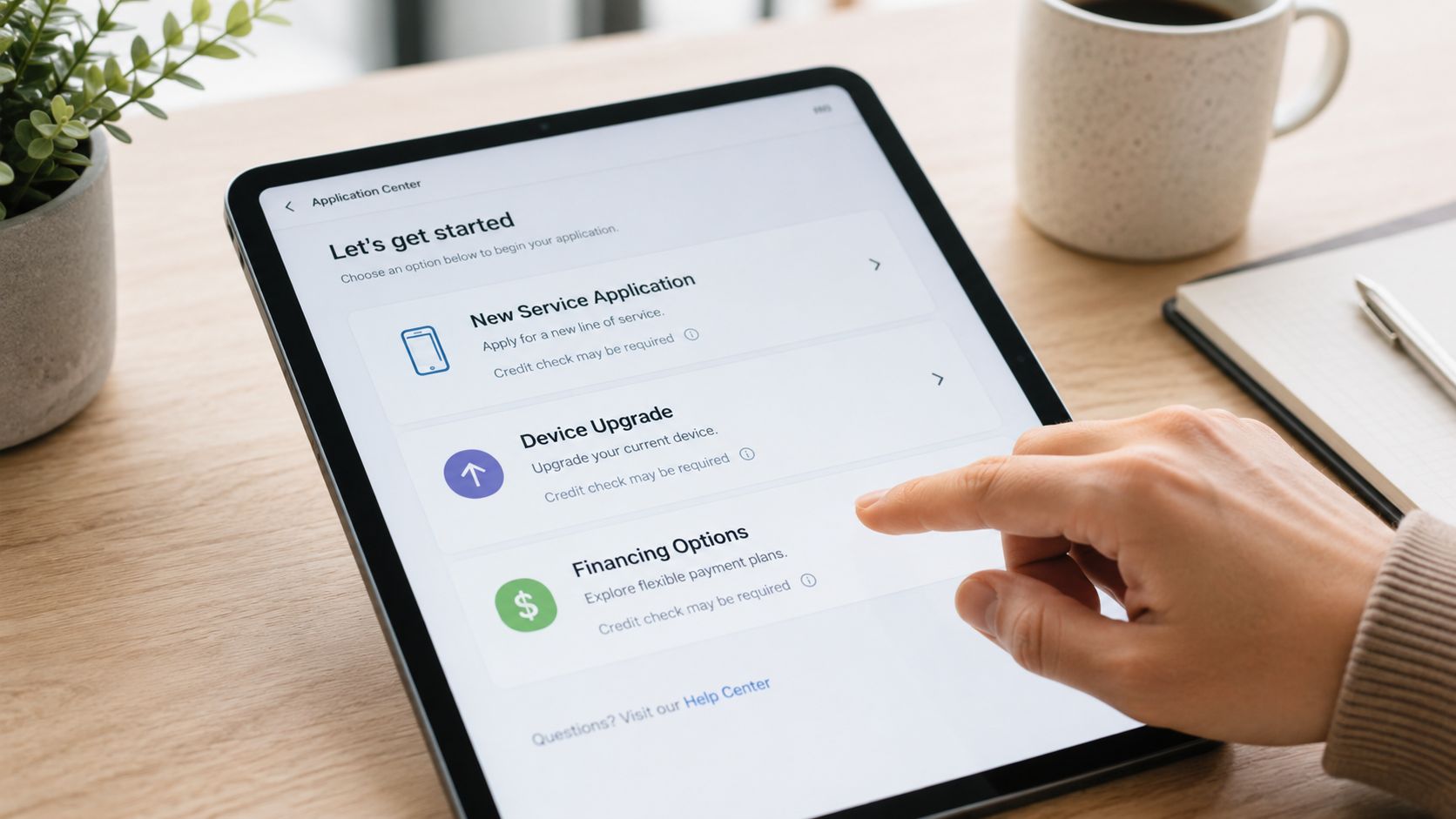 A person using a tablet to navigate a mobile service application menu with various financing and upgrade options.